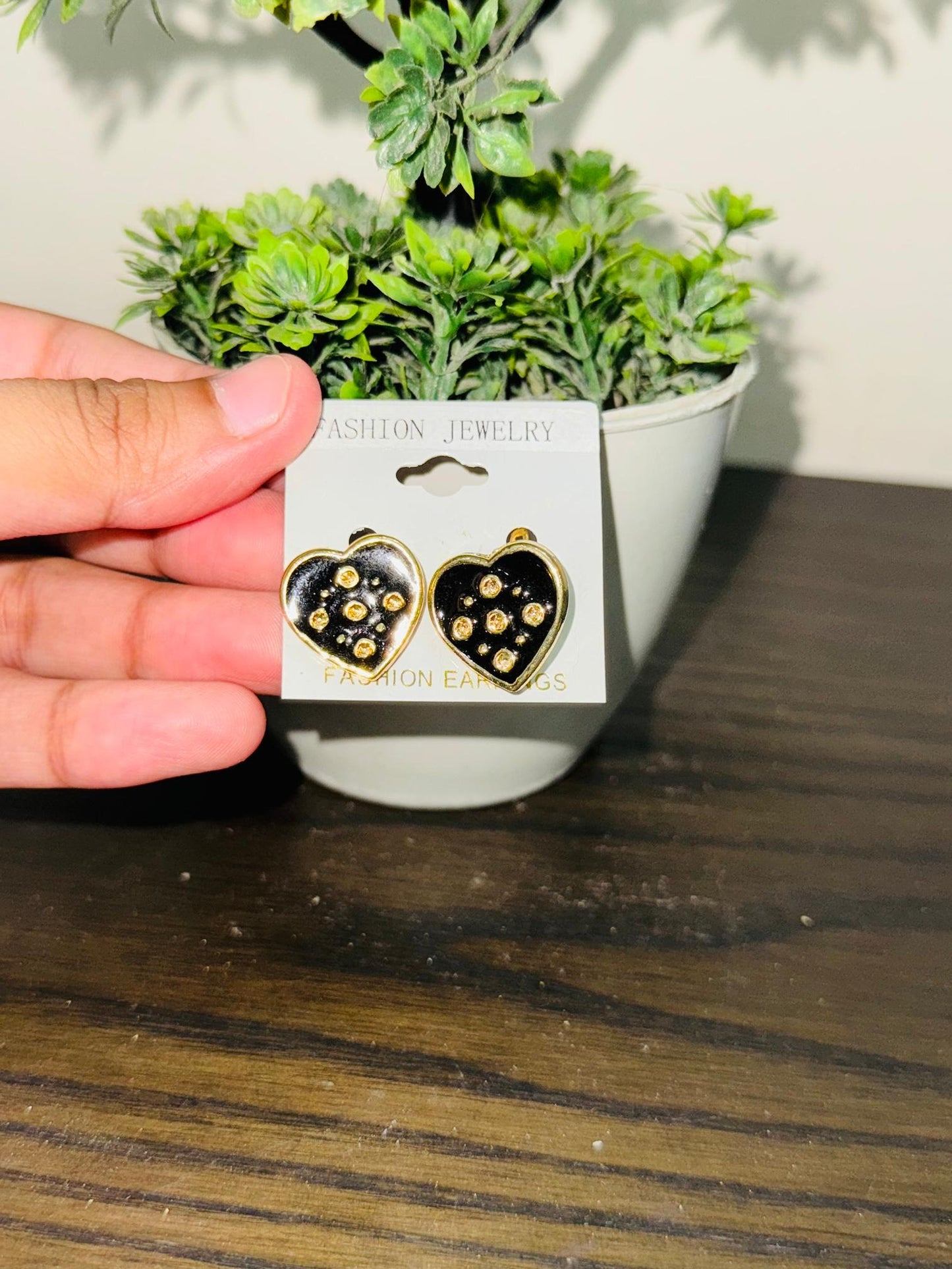 Black gold heart studs
